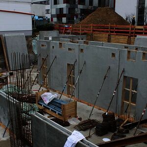 More prefabricated walls for the basement are set up…