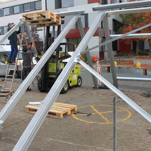 The frame for the ventilation system is assembled on the car park in front of DIATEST…