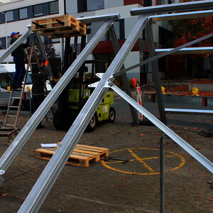 The frame for the ventilation system is assembled on the car park in front of DIATEST…