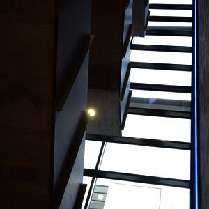 The new staircase, seen from the inside: the stairs appear to float weightlessly; note the blue LED illumination