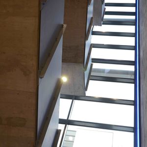 The new staircase, seen from the inside: the stairs appear to float weightlessly; note the blue LED illumination