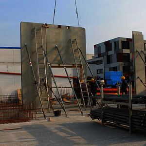 The first walls of the first floor are set up…