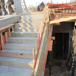 View from the staircase into the basement for the future social space …