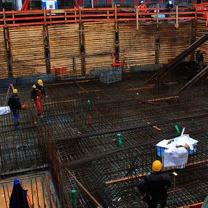 The foundation is going to be prepared. On the right of the photo, the steel beams support the neighboring site…