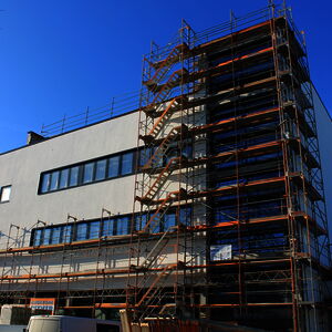 The scaffolding is partly removed from the building…