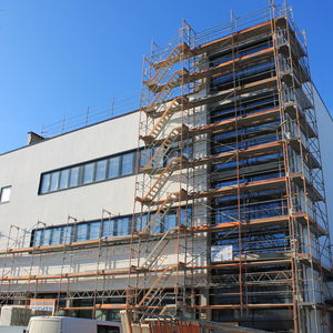 The scaffolding is partly removed from the building…